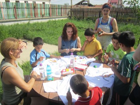 Volunteers, Valerie Farnworth, Christine Jamieson and Sandra Strachan painting t-shirts with children at the Peter Pan orphanage - Photo: Shetland to Romania Orphanage Project 2011