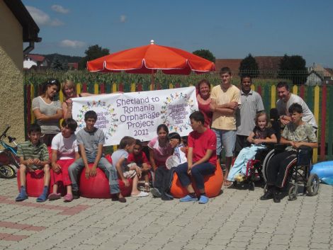 Valerie Farnworth, Tracy Webb and Mark Wylie with some of the residents of Casa Sf. Patrick and Casa Irlanda - Photo: Shetland to Romania Orphanage Project 2011
