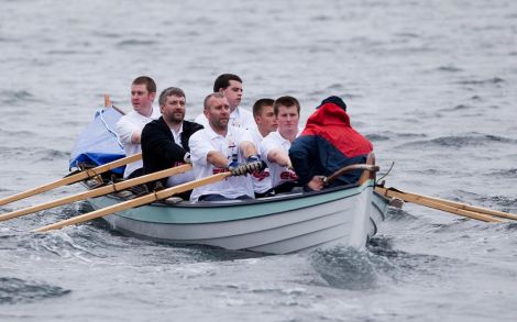 Rowing all the way to Faroe. From left to right: Scott Johnson, Ian Smith, Ian Coutts, Roberts Sandison, Andrew Coutts, and Euan Smith, coxwain Stuart Williamson - Photo: Garry Sandison
