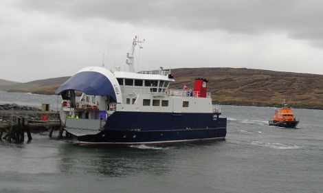The ferry Linga berthing at Lax with the Lerwick, lifeboat standing by - Photo: Hans J Marter
