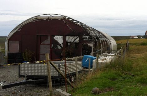 The remains of the boat in the burnt out polytunnel in Girlsta - Photo: Shetland News