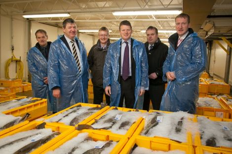 At Lerwick fish market on Tuesday morning. From left: SFA chairman Leslie Tait, local MP Alistair Carmichael, Shetland Seafood Auctions' Martin Leyland, UK fishing minister Richard Benyon, SFA chief executive Brian Isbister and local MSP Tavish Scott. Pic. Ben Mullay