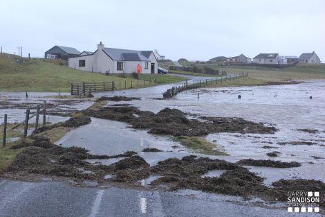 The sea rose three feet above the road at Mail in Cunningsburgh at the noon high tide. Pic Garry Sandison
