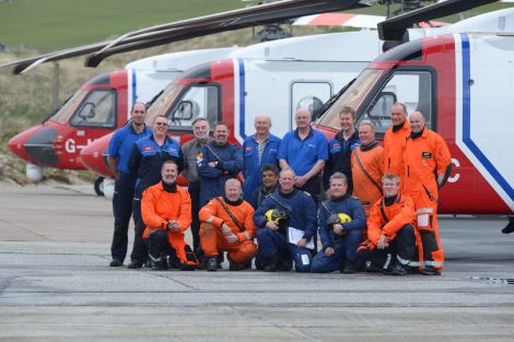 Captains, pilots, air crew and engineers who arrived at Sumburgh airport to oversee the transition period - Photo: Malcolm Younger/Millgaet Media.