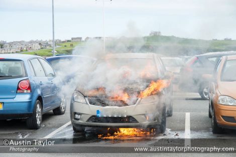 Hot, hot, hot! Photographer Austin Taylor captured this Kia on fire at Tesco car park just before the fire brigade arrived.