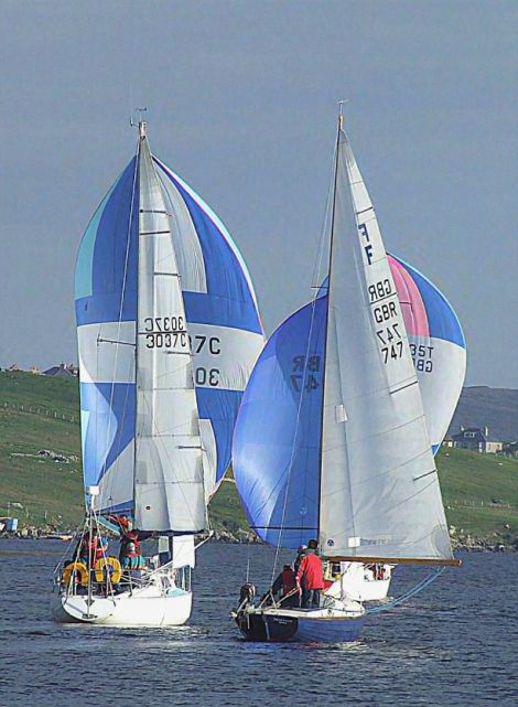 Movin' On and Rebellion battle it out in an earlier regatta. Photo Jim Tait