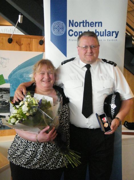 Special constable Peter Smith with his wife Stella receiving his long service award two years ago after more than 30 years with Northern Constabulary