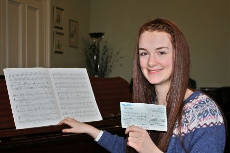 Teeanger Sophie Wishart with the prize she won for her outstanding exam result.