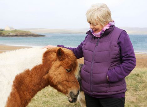 Getting to know the local ponies: Alison Steadman at Reawick beach _ Photo: ITV