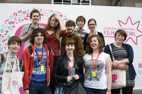 Young film maker Jenny Brown (centre front), flanked by four other new members of Maddrim Media during an exchange with SKAMM in Edinburgh last month. To Jenny's left are Eve Christie and Logan Nicolson, and to her right are Joanne Tait and Freya Stout. behind her are five members of SKAMM. Photo Maddrim Media