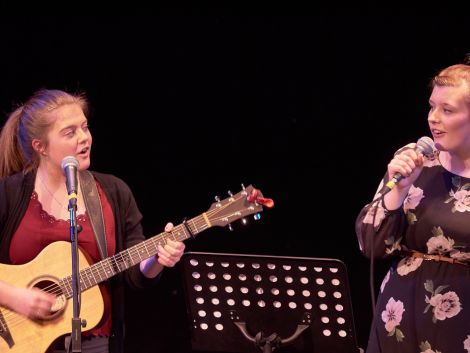 First on stage with their pitch perfect harmonies were Yell duo Megan Nisbet and Lauren Johnson. Photo Chris Brown