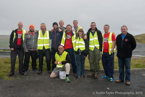 All the walkers at the Bigton junction with Shavonne Newlands. Left to right: David Summers, Danny Carter, John-William Halcrow, Gary Smith, Chris Macgregor (kneeling), Ian Henderson, Adam Lewis, Danny O’Sullivan, Shavonne Newlands, Michael More, Marc Sherwood and Ross Smith. Photo: Austin Taylor