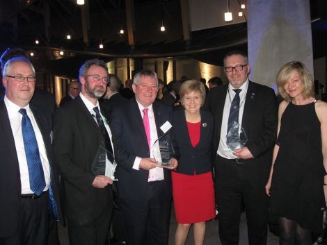 First Minister Nicola Sturgeon congratulates the OIOF leaders on their award. From left to right: Malcolm Burr (Western Isles), Steven Heddle (Orkney), Angus Campbell (Western Isles), SIC leader Gary Robinson and Gillian Morrison (Orkney).