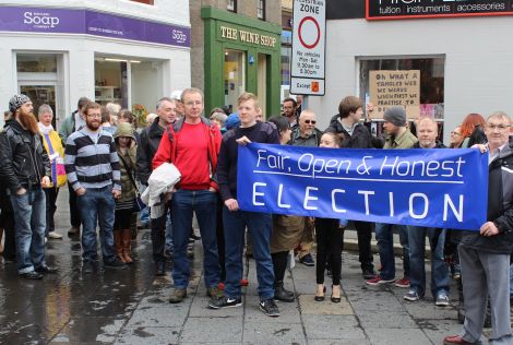 Protesters gather at Lerwick's Market Cross on Saturday - Photos: ShetNews