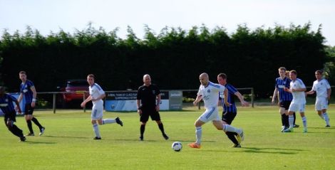 Shetland’s James Johnston (centre) on the ball during the team's handsome 5-0 victory over the FAaklands. Photo: Shetland Island Games Association