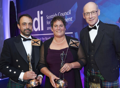 Accepting their awards from Scottish finance secretary John Swinney (right) are Dave Cockerill (Marine Harvest) and Celine Kimpflin (Scottish Sea Farms) - Photo: SCDI