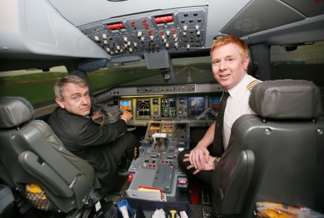 UK transport minister Robert Goodwill (left) during a visit to Flybe's trading academy in Exeter last year. This week he said he was sure Loganair flights were safe.