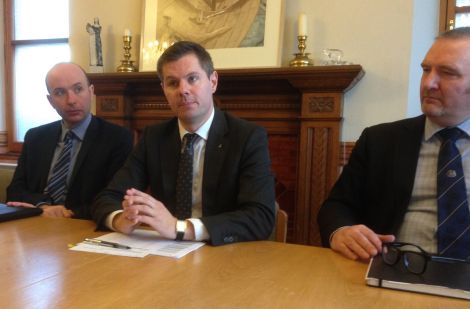 Scottish transport and islands minister Derek Mackay, flanked by fellow SNP minister Marco Biagi and SIC political leader Gary Robinson at Lystina House on Monday. Photo: Shetnews