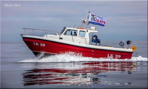 Shetland boat Spindrift flies the Brexit flag. Photo Ivan Reid
