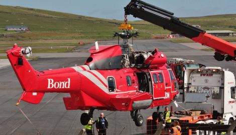 A helicopter being prepared ahead of its journey from Sumburgh to Lerwick on Wednesday. Photo: Ronnie Robertson