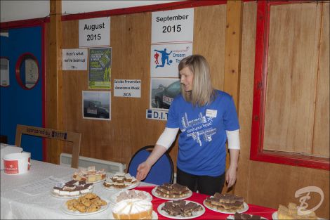 Nicola Halcrow with just a few of the mountain of home bakes generously donated. Photo: Dale Smith