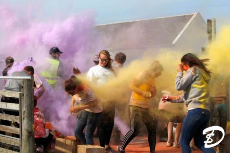 Caption: The Messy Slester Fun Run colour saw 200 participants being pelted with powdered paint. It is set to become an annual event – Photo: Dale Smith