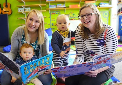 Mums Jody Weaver (left) and Karen Thomason reading to their children Jessi (13 months) and Bobby (11 months) - Photo: Hans J Marter/ShetNews