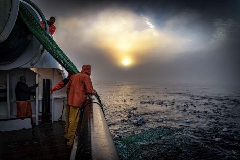Ian Reid's image captures the process of hauling in the net on board the new Resilient.