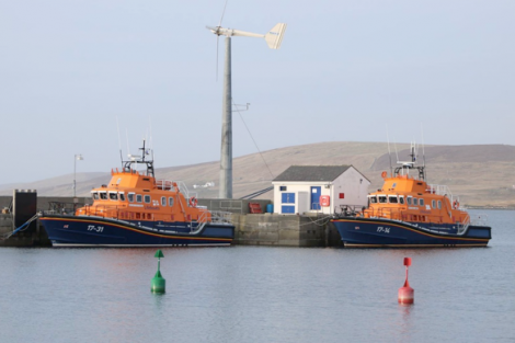 The Charles Lidbury pictured alongside its replacement recently in Aith. Photo: RNLI/John Robertson