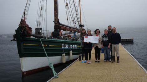 Members of the Swan Trust receiving a cheque for £3,000 from Aith pupils earlier this week. Photo courtesy of the Swan Trust.