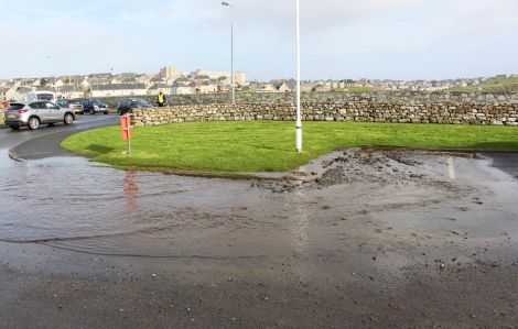 Water flooded the entrance to the car park. Photo: Chris Cope/Shetland News