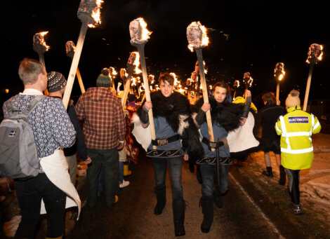 A group of people carrying torches.